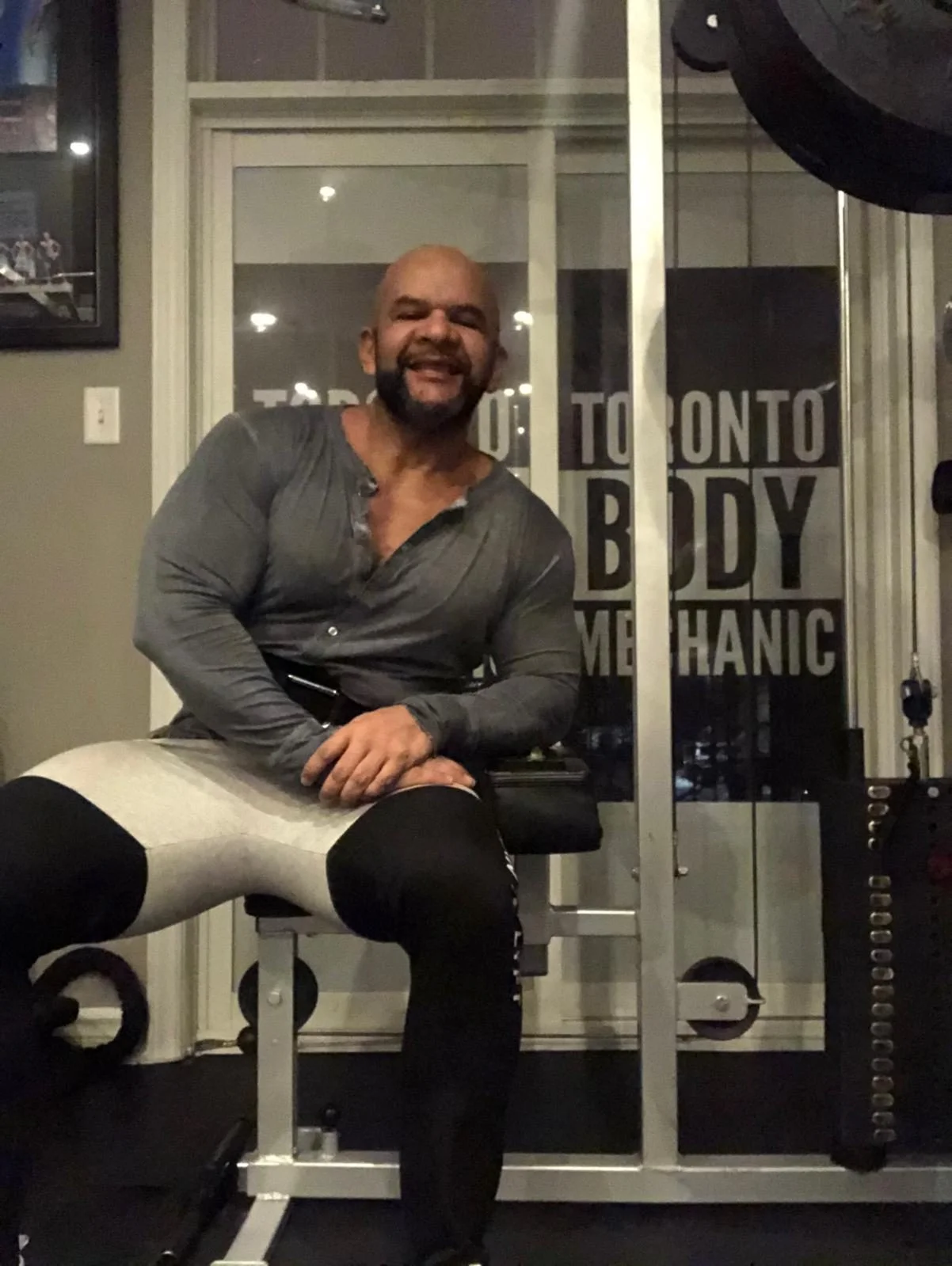 Ernesto Castillo seated in the Toronto Body Mechanic studio