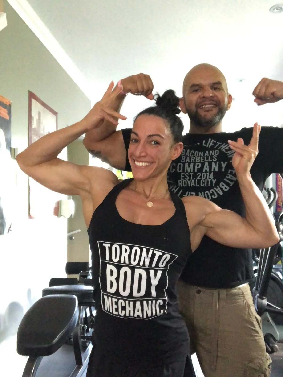 Ernesto Castillo and a TBM community member posing at the studio